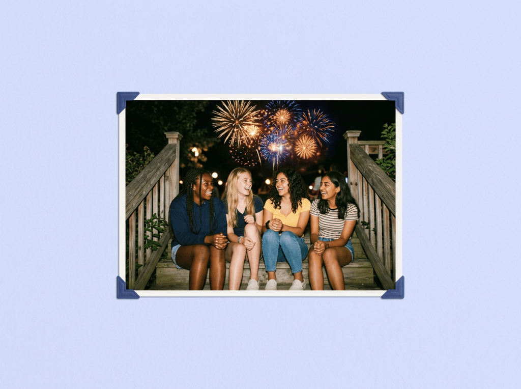 teen girls sitting under fireworks